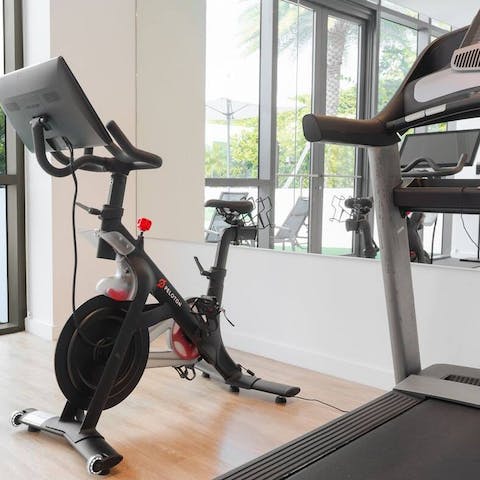 Work up a sweat in the residents' gym, beating your personal best on the Peloton