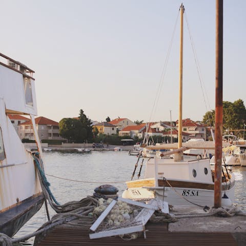 Watch the sunset from the marina, a seven-minute walk away
