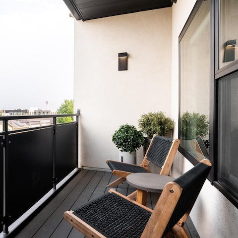 Sip a glass of wine on the private balcony after a day of Denver sightseeing