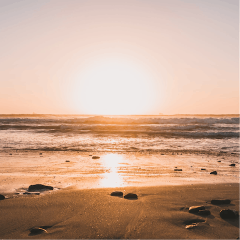 Wander down to the intimate and rocky Bakoven Beach