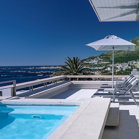 Soak up the sun on the penthouse balcony by the private pool