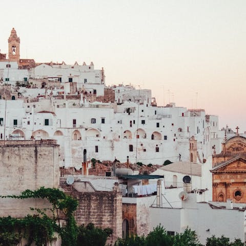 Visit the whitewashed old town of Ostuni, a twenty-minute drive away