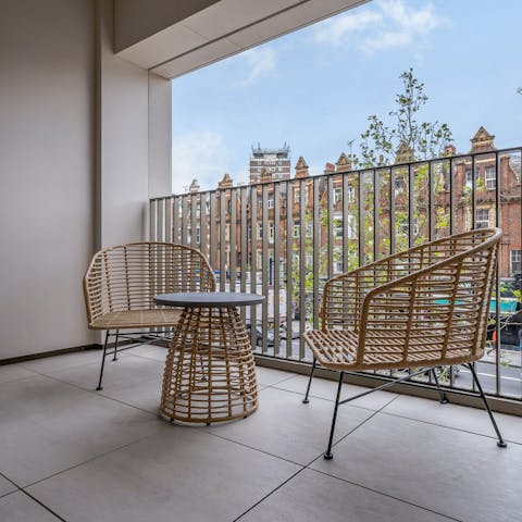 Share evening drinks on the private balcony after a busy day in the city