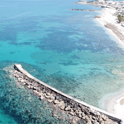 Take a dip in the clear waters of Anisaras, only a fifteen-minute walk away