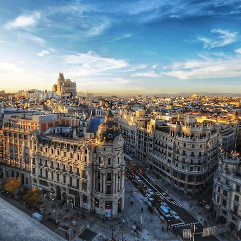 Stroll down the bustling Gran Vía, a ten-minute walk away