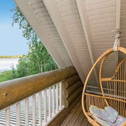 Enjoy the beautiful surroundings from the cabin's balcony