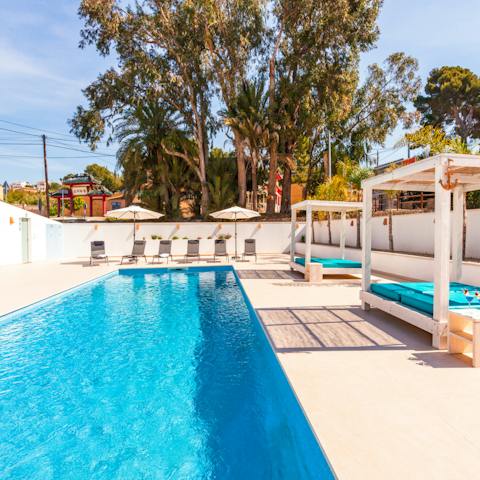 Cool down with a refreshing dip in the glittering, shared pool