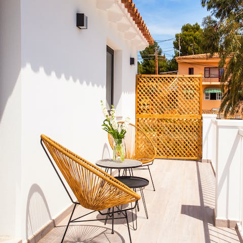 Sit out on the balcony to enjoy your first cup of coffee every morning