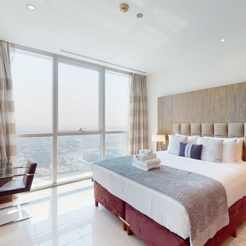 Draw open the drapes and enjoy floor-to-ceiling views from your bedroom