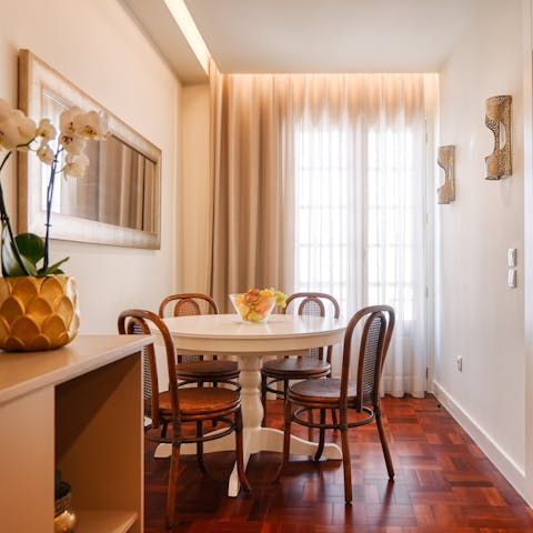 Enjoy your pastel de natas and coffee around the window-side dining table