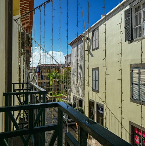 Watch the locals go about their day from your Juliet balcony