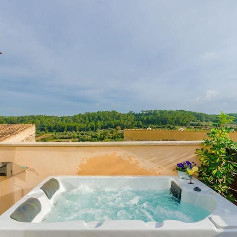 Take a dip in the rooftop hot tub and enjoy stunning views