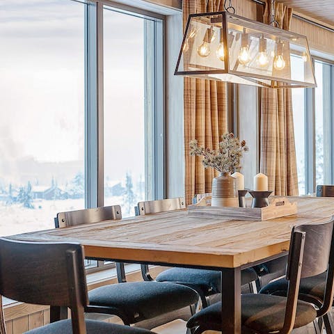 Gather around the dining table for a delicious feast with breathtaking views