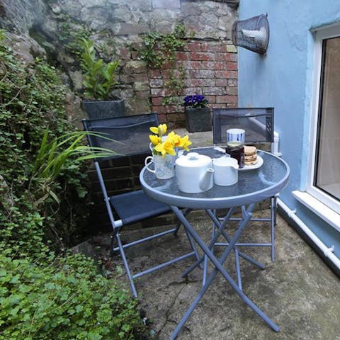 Sip your morning coffee on the home's plant-covered terrace