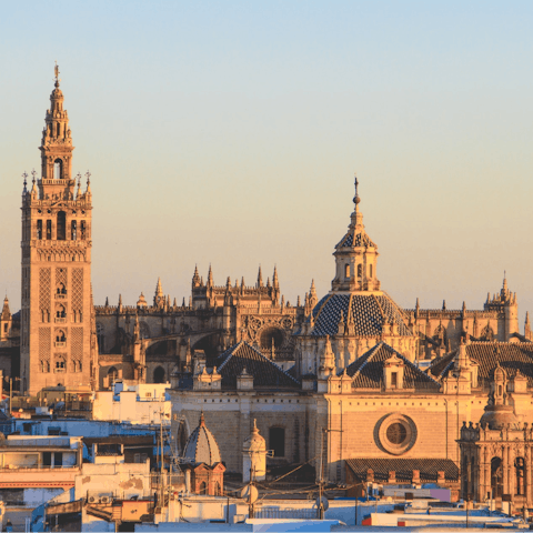 Stroll to Seville Cathedral and admire the magnificent architecture
