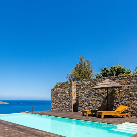 Take a dip in the private outdoor pool while gazing out at ocean views