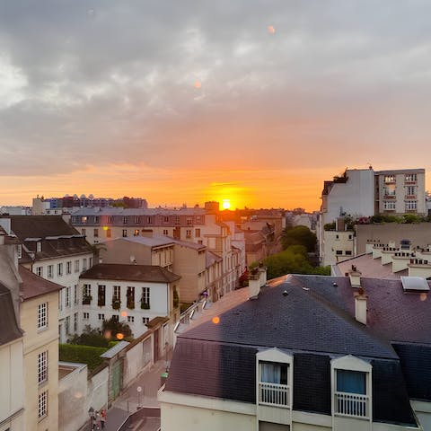 Watch the sunset over Paris' rooftops with a glass of wine