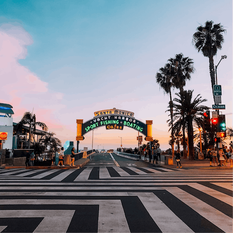 Take the eight-minute minute drive to the Santa Monica Pier