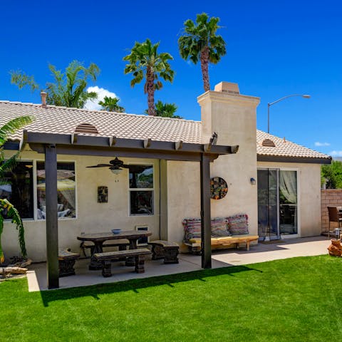 Serve up dinner alfresco under the shady pergola