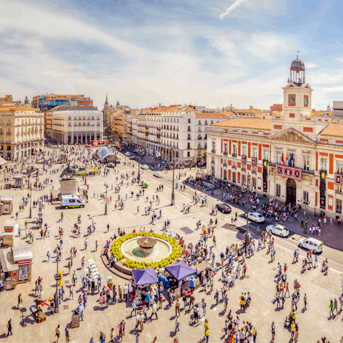 Visit bustling Puerta del Sol, twenty-five minutes away by Metro