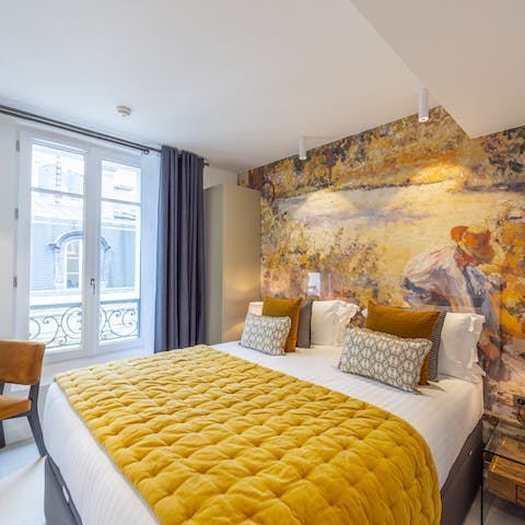Wake up in the charming yellow-toned bedroom, ready for another day in Paris