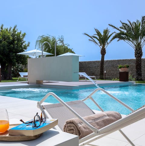 Soak up the sun by the crystal waters of the private pool