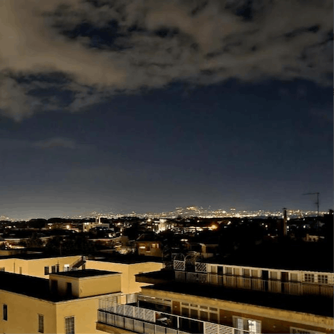 Watch the lights of Rome flicker on from your rooftop verranda