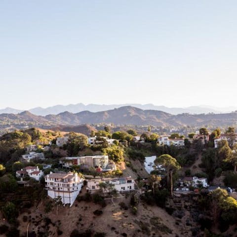 Explore the exclusive Hollywood Hills area, including the Hollywood Reservoir Trail, less than a five-minute drive from this home