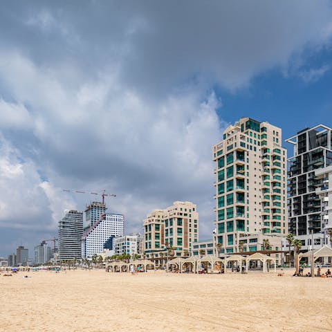 Soak up the hot sun on Aviv Beach, a short walk away