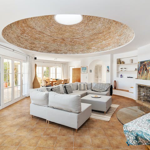 Discuss your daily plans under a skylit dome in this wholly unique living space