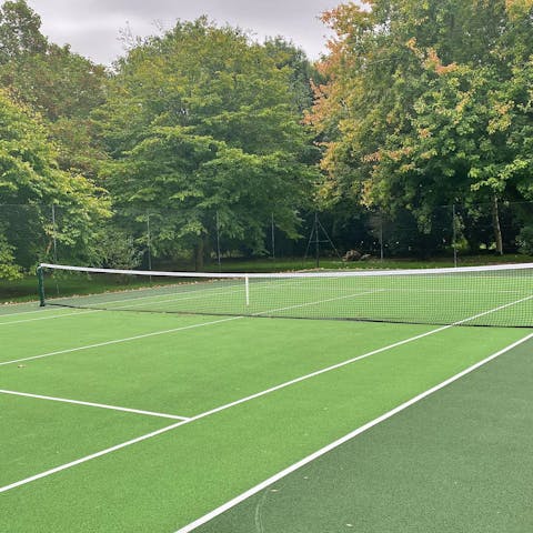 Venture out into the garden and host a tennis tournament on the leafy court