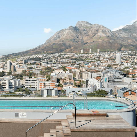Take the plunge in the rooftop communal swimming pool and enjoy incredible wrap-around views