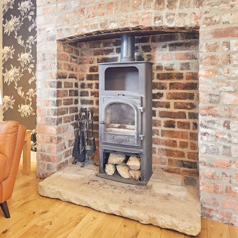 Cosy up in front of the fireplace after a day on Filey Beach