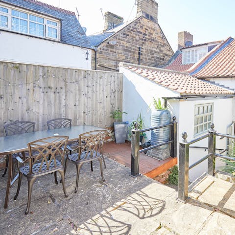 Enjoy alfresco meals in the private, sun-drenched garden