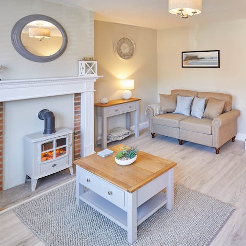 Snuggle up by the living room's fire on cooler nights