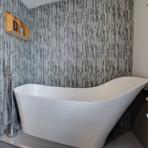 Spend chilly evenings soaking in your modern tub, pinot noir in hand