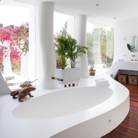 Treat yourself to an indulgent soak in the curved bathtub