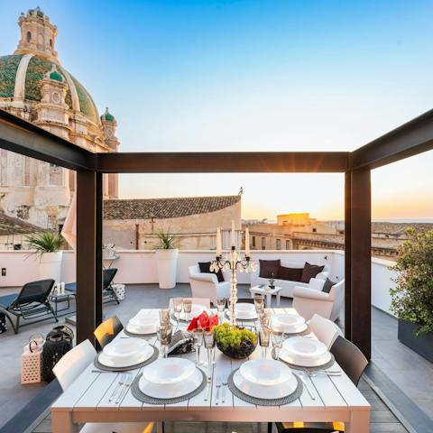 Dine out on the terrace as the sunsets, with views of the sea and the city