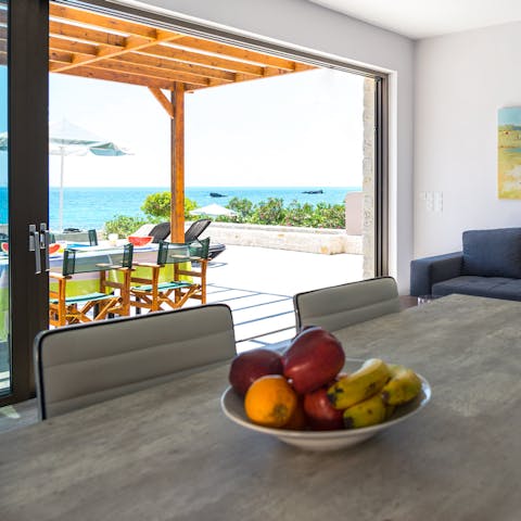 Enjoy a meal indoors or outdoors with magnificent sea views