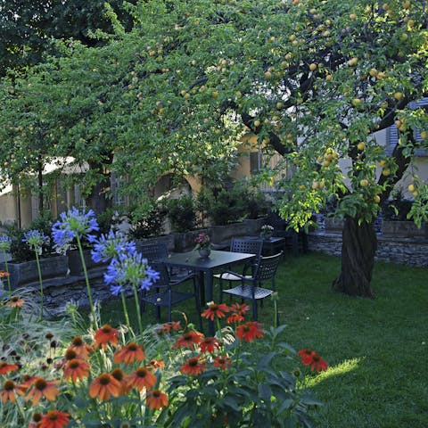 Sip your morning coffee beneath the trees in the pretty garden