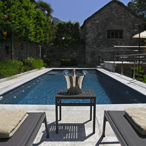 Open a bottle of fizz and dip your toes in the private swimming pool