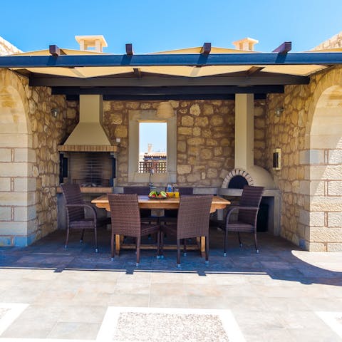 Enjoy alfresco breakfasts and evening barbecues beneath this sun-shaded pergola