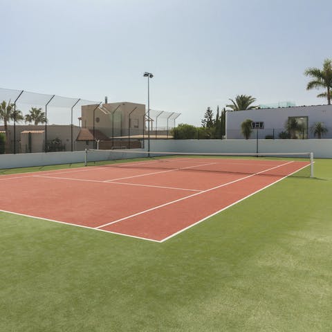 Play a game of tennis as the sun warms your skin