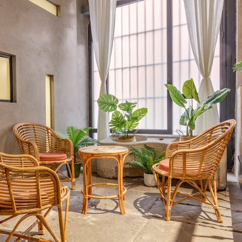 Relax in the leafy lounge area as the sun pours through the huge industrial windows 