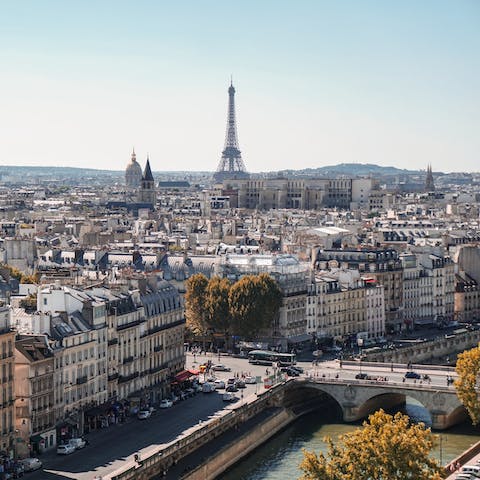 Stroll across the Pont-Neuf, Paris' oldest bridge over the river Seine