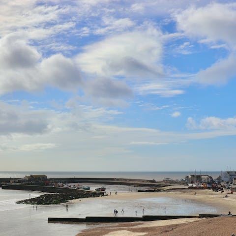 Take the minute stroll to Lyme Regis Beach and dip your toes in the water