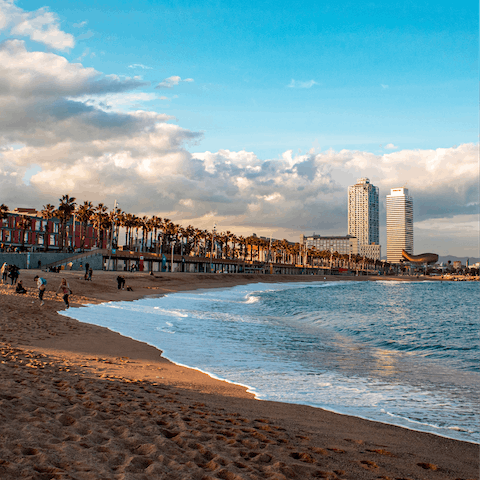 Spend the day in the surf of Platja de la Mar Bella, a short drive away