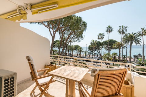 Drink wine on the balcony as you enjoy the Mediterranean Sea views
