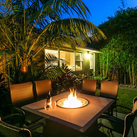 Wind down with a drink around the table fire pit