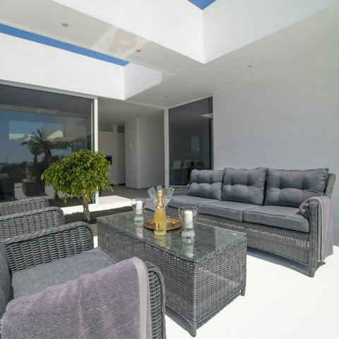 Sit out on your patio with a sundowner in hand, on your comfy outdoor lounge area